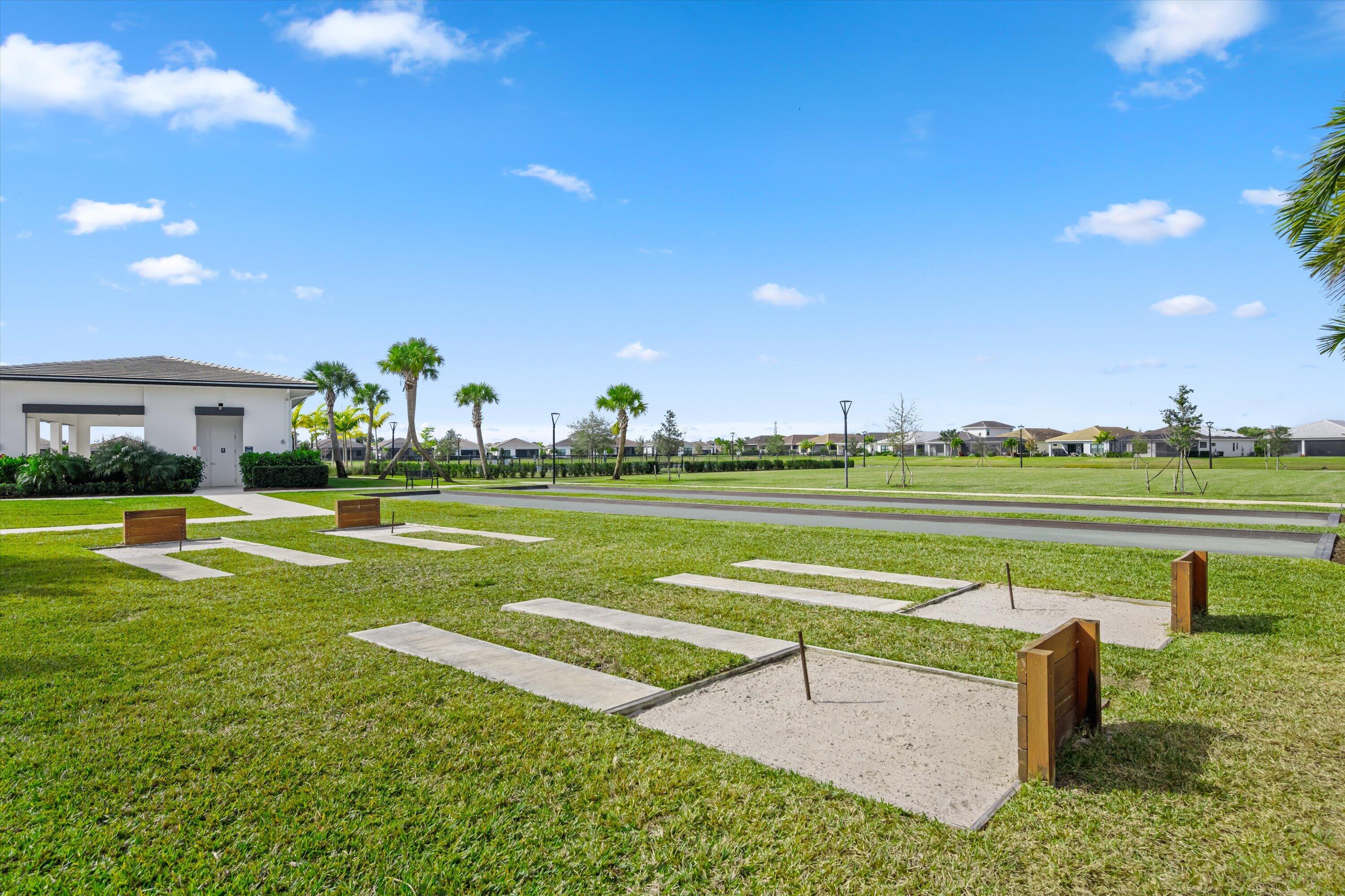 4891 Rivo Alto Circle Loxahatchee, FL 33470 - Photo 39 of 64 a view of a house with a swimming pool