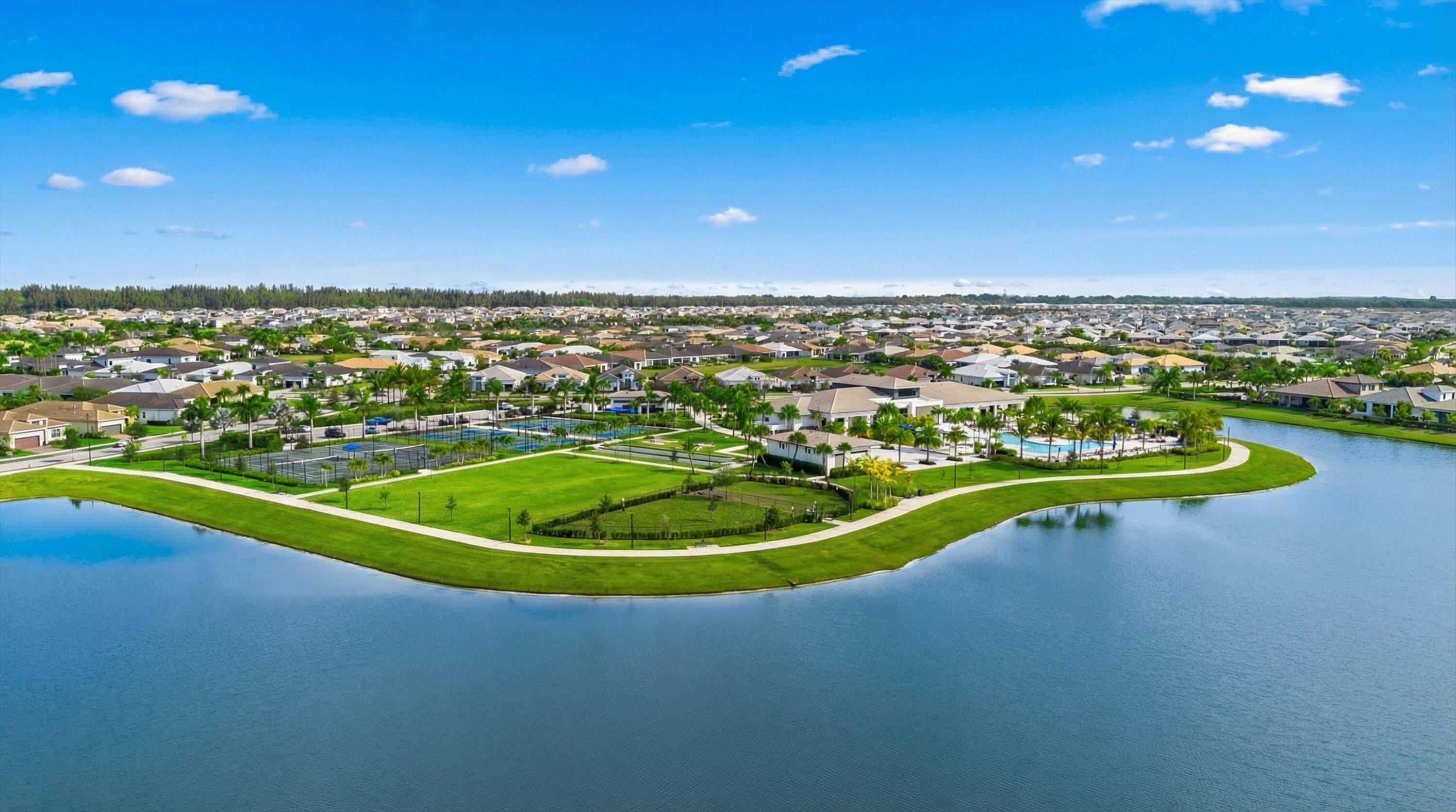 4891 Rivo Alto Circle Loxahatchee, FL 33470 - Photo 41 of 64 a view of a swimming pool with a lake view and mountain view