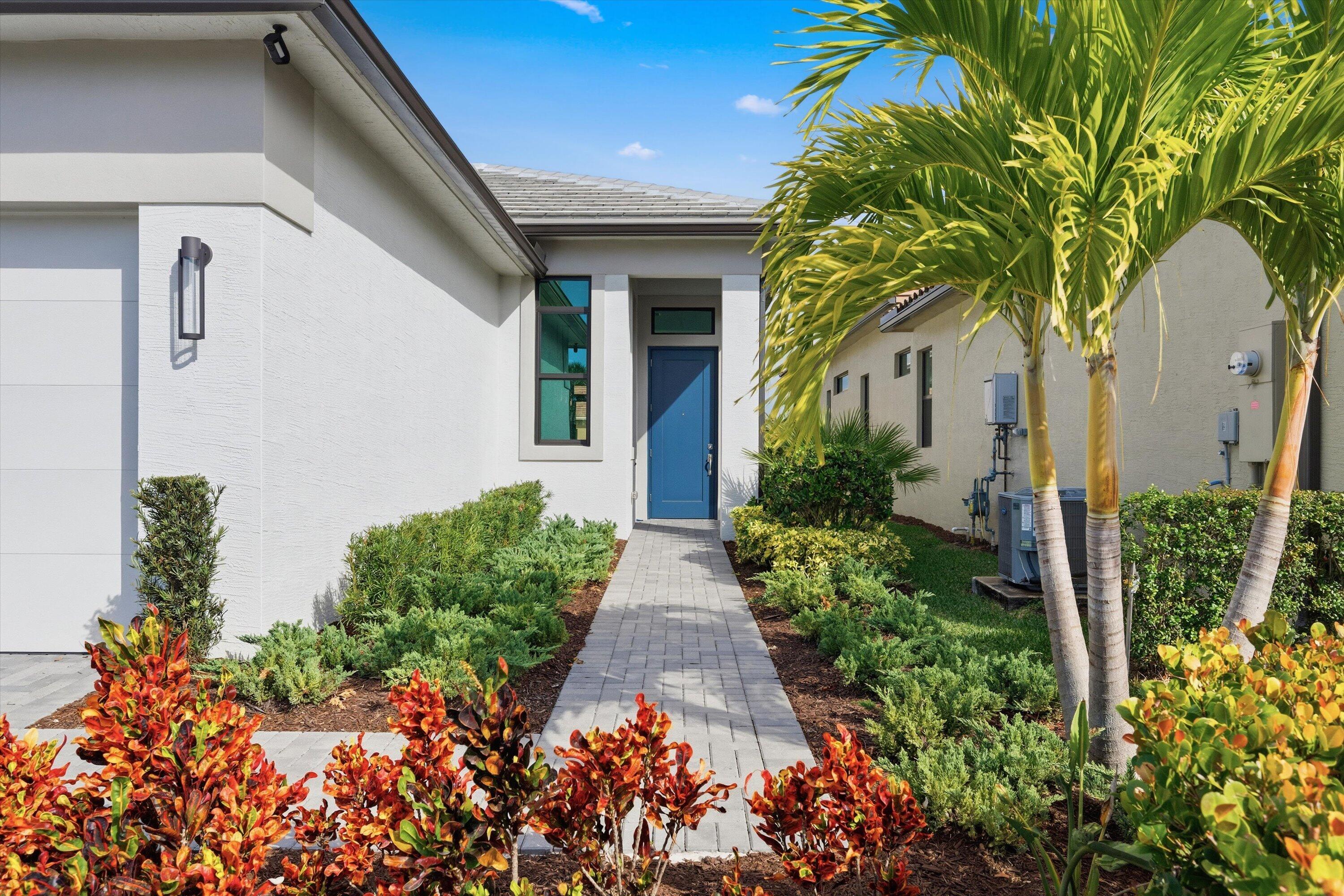 4891 Rivo Alto Circle Loxahatchee, FL 33470 - Photo 5 of 64 a view of a pathway with potted plants