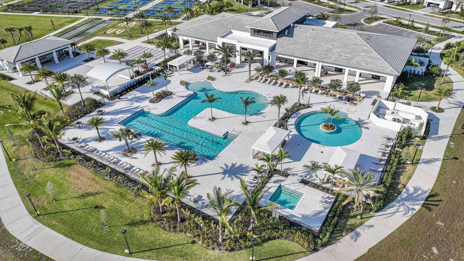 4891 Rivo Alto Circle Loxahatchee, FL 33470 - Photo 57 of 64 an aerial view of a swimming pool with outdoor seating