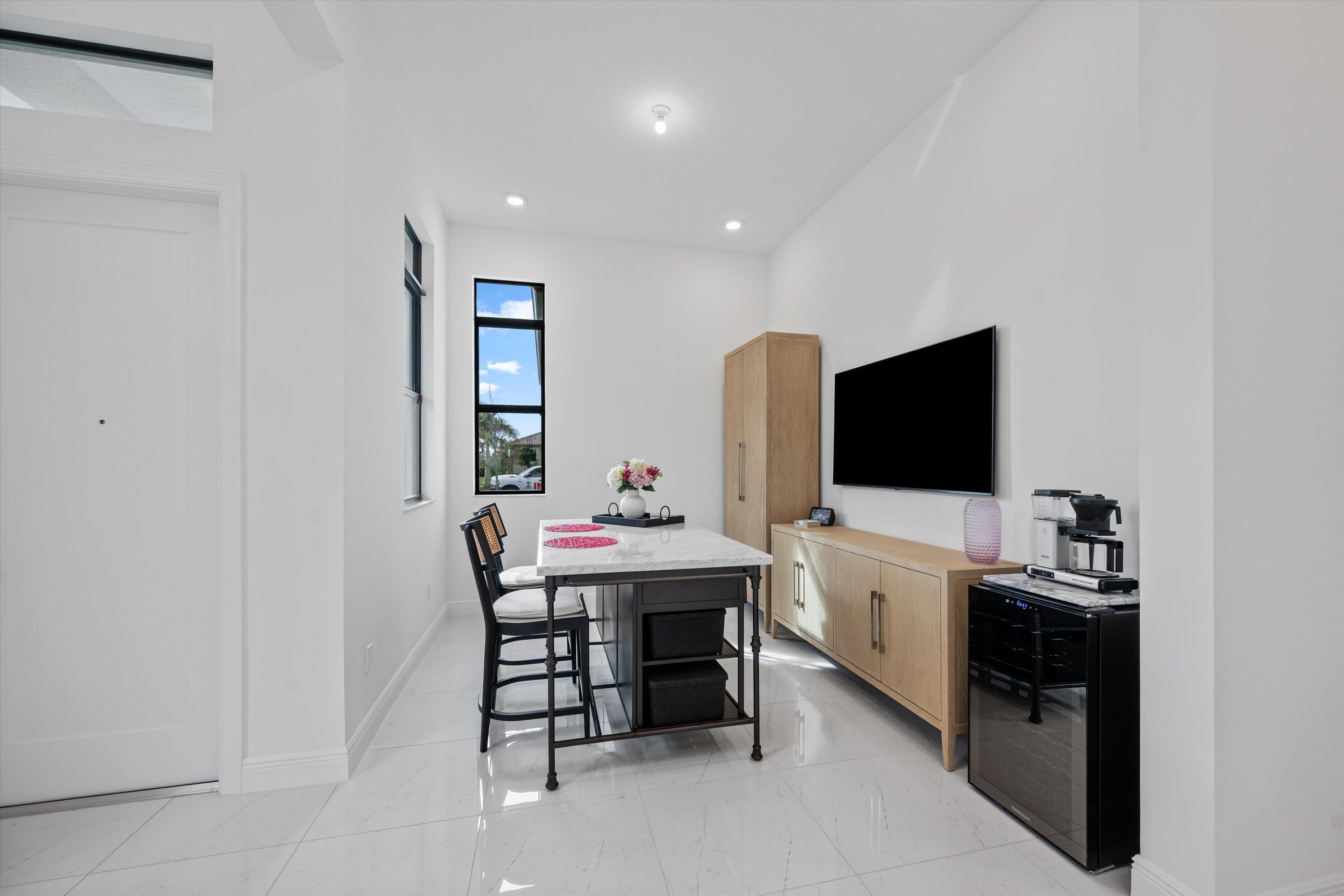 4891 Rivo Alto Circle Loxahatchee, FL 33470 - Photo 8 of 64 a view of a workspace with furniture