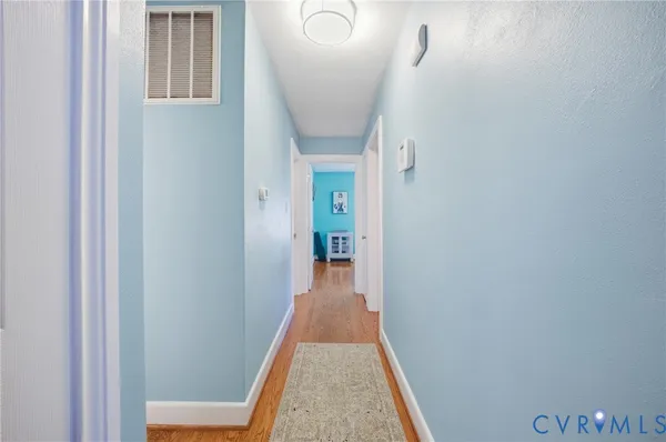 a bathroom with a sink a toilet a mirror and shower