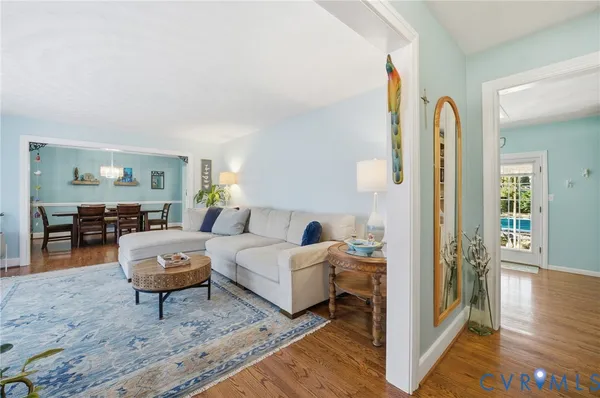 a living room with furniture and a rug