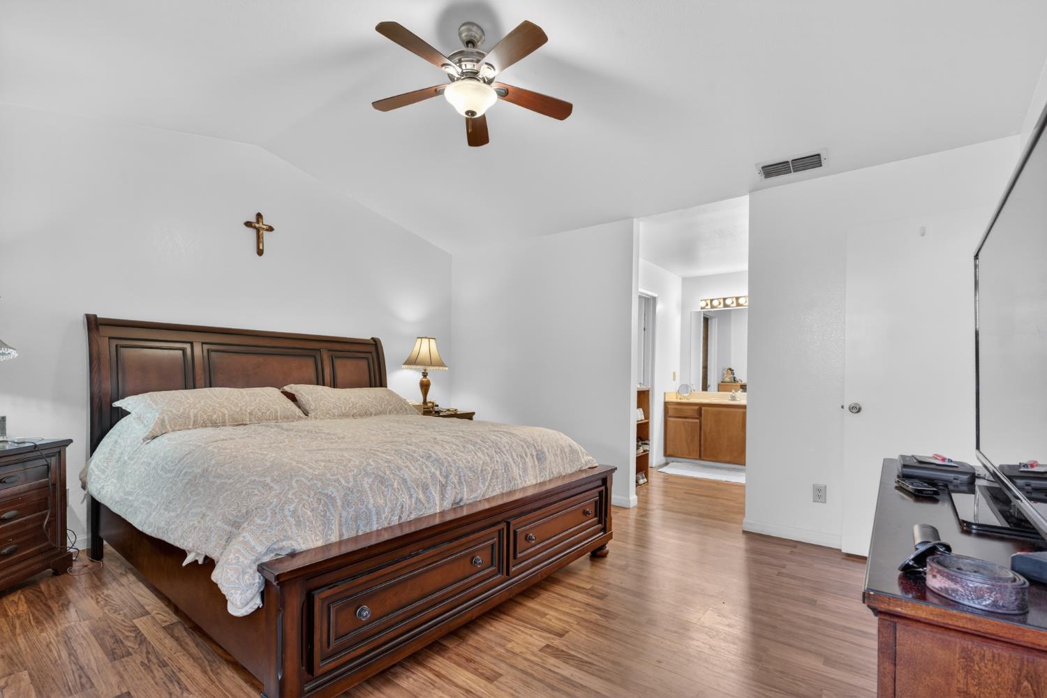 3072 Radford Way Turlock, CA 95382 - Photo 11 of 16 a bedroom with a bed and a chandelier