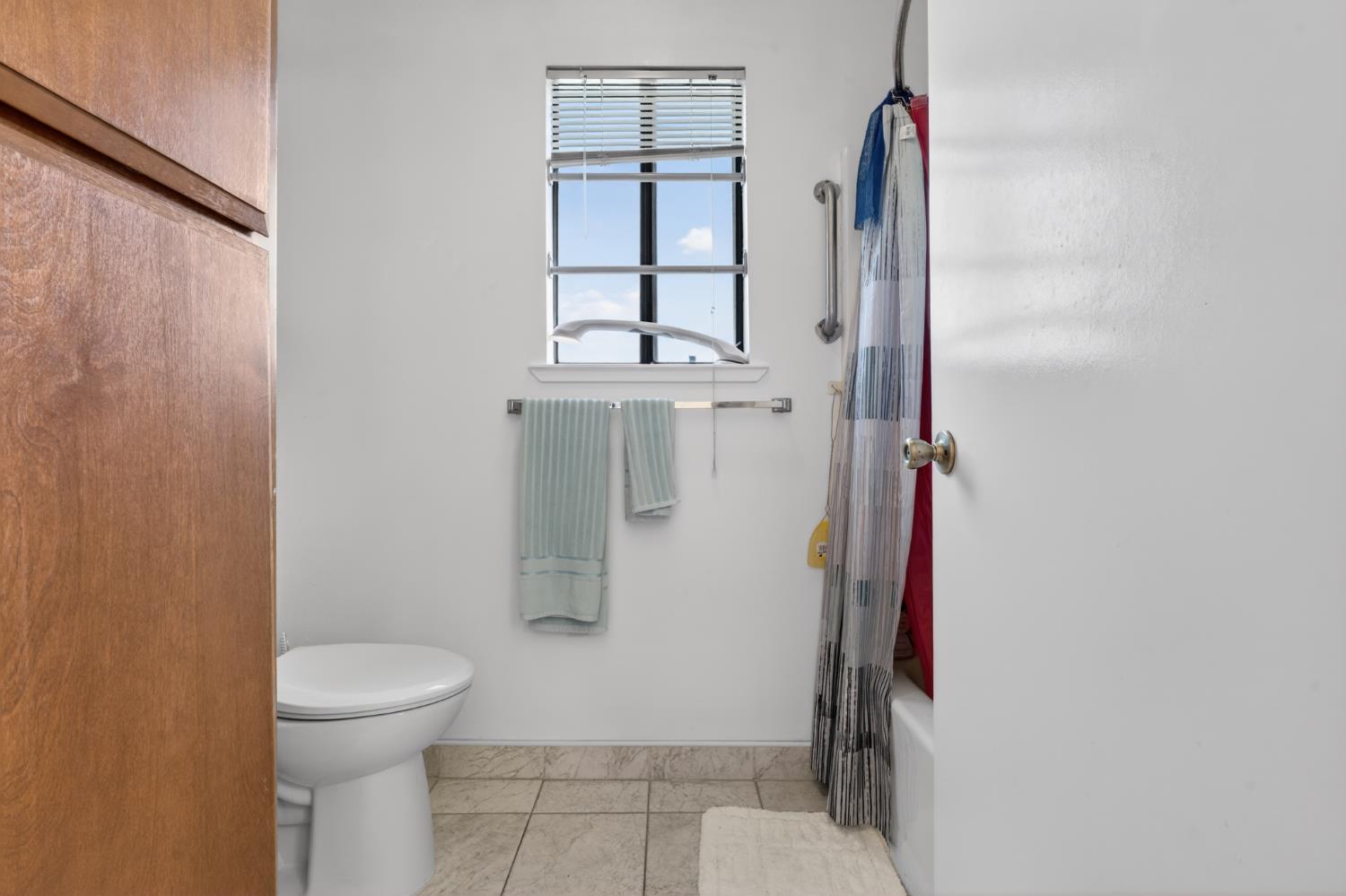 3072 Radford Way Turlock, CA 95382 - Photo 15 of 16 a bathroom with a toilet and a shower
