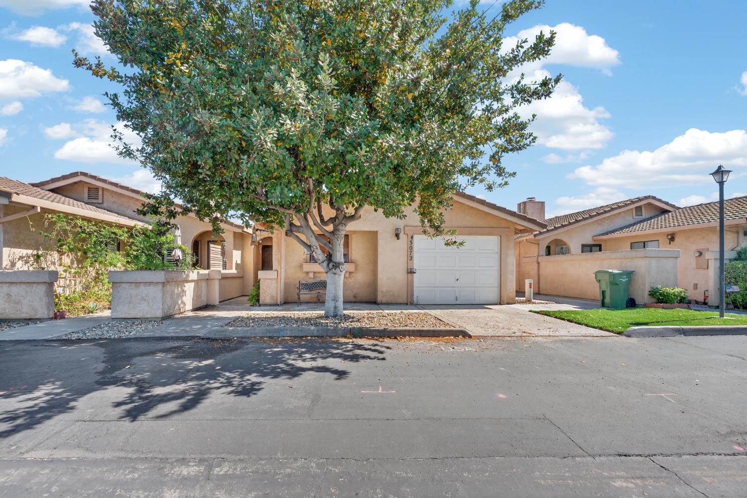 3072 Radford Way Turlock, CA 95382 - Photo 2 of 16 a house that has a tree in front of it