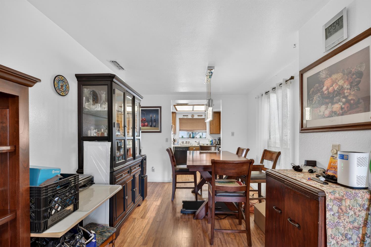 3072 Radford Way Turlock, CA 95382 - Photo 7 of 16 a dining room with furniture and wooden floor