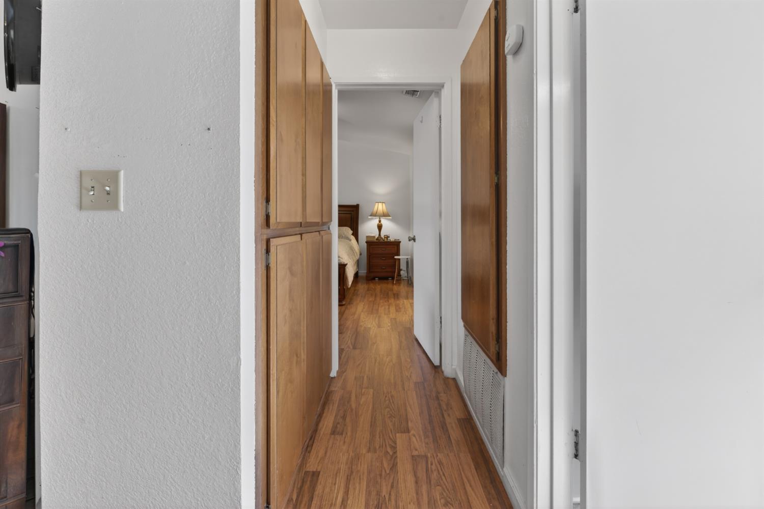 3072 Radford Way Turlock, CA 95382 - Photo 9 of 16 a view of a hallway with wooden floor