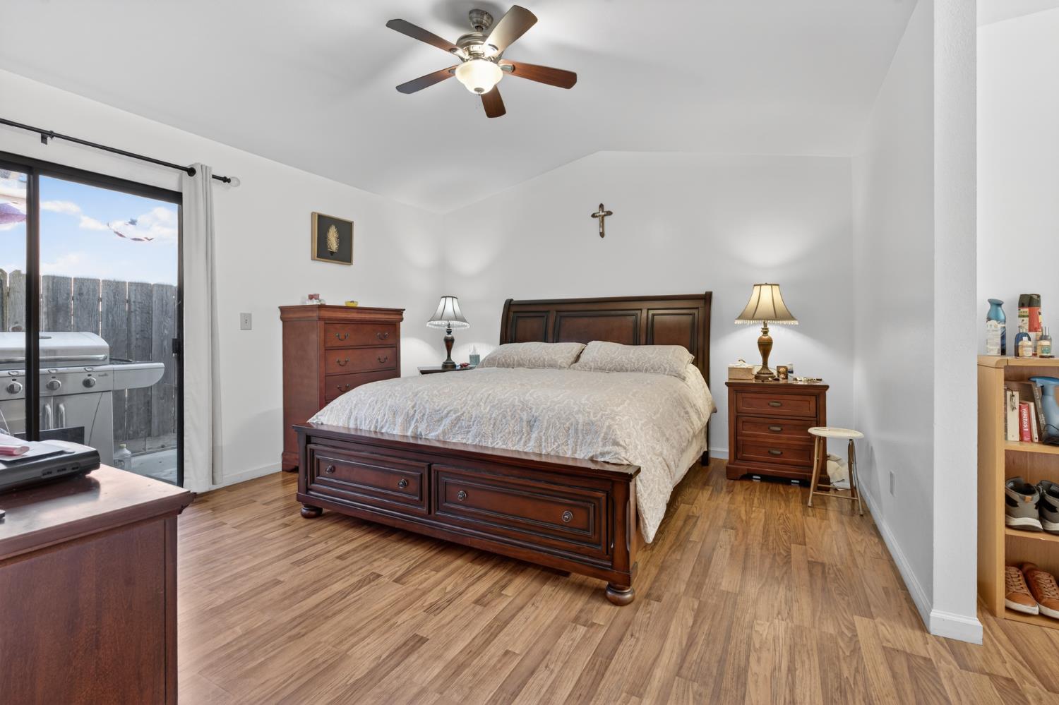 3072 Radford Way Turlock, CA 95382 - Photo 10 of 16 a bedroom with a bed and wooden floor
