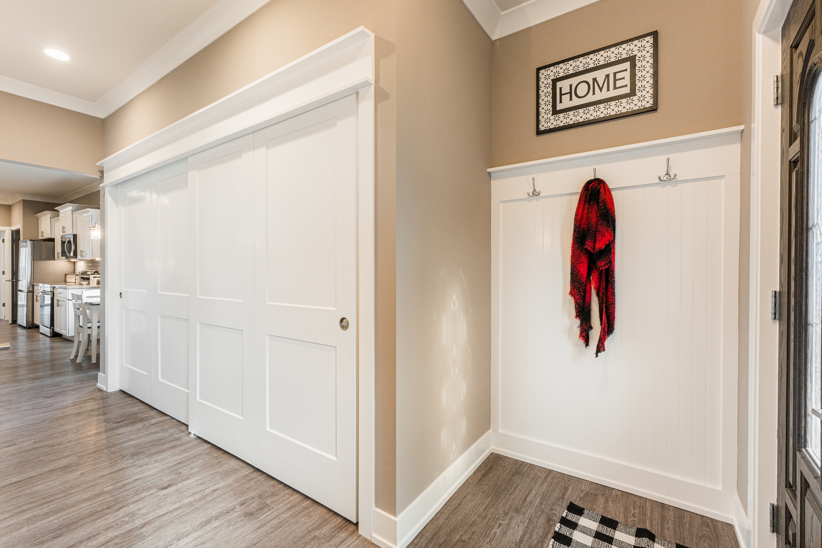 108 Boulder Court, Unit 108 Genoa, IL 60135 - Photo 3 of 25 a view of a hallway with wooden floor and entryway