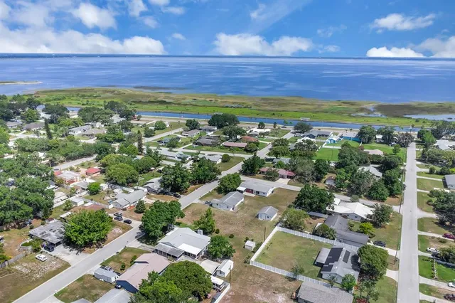 an aerial view of residential houses with outdoor space