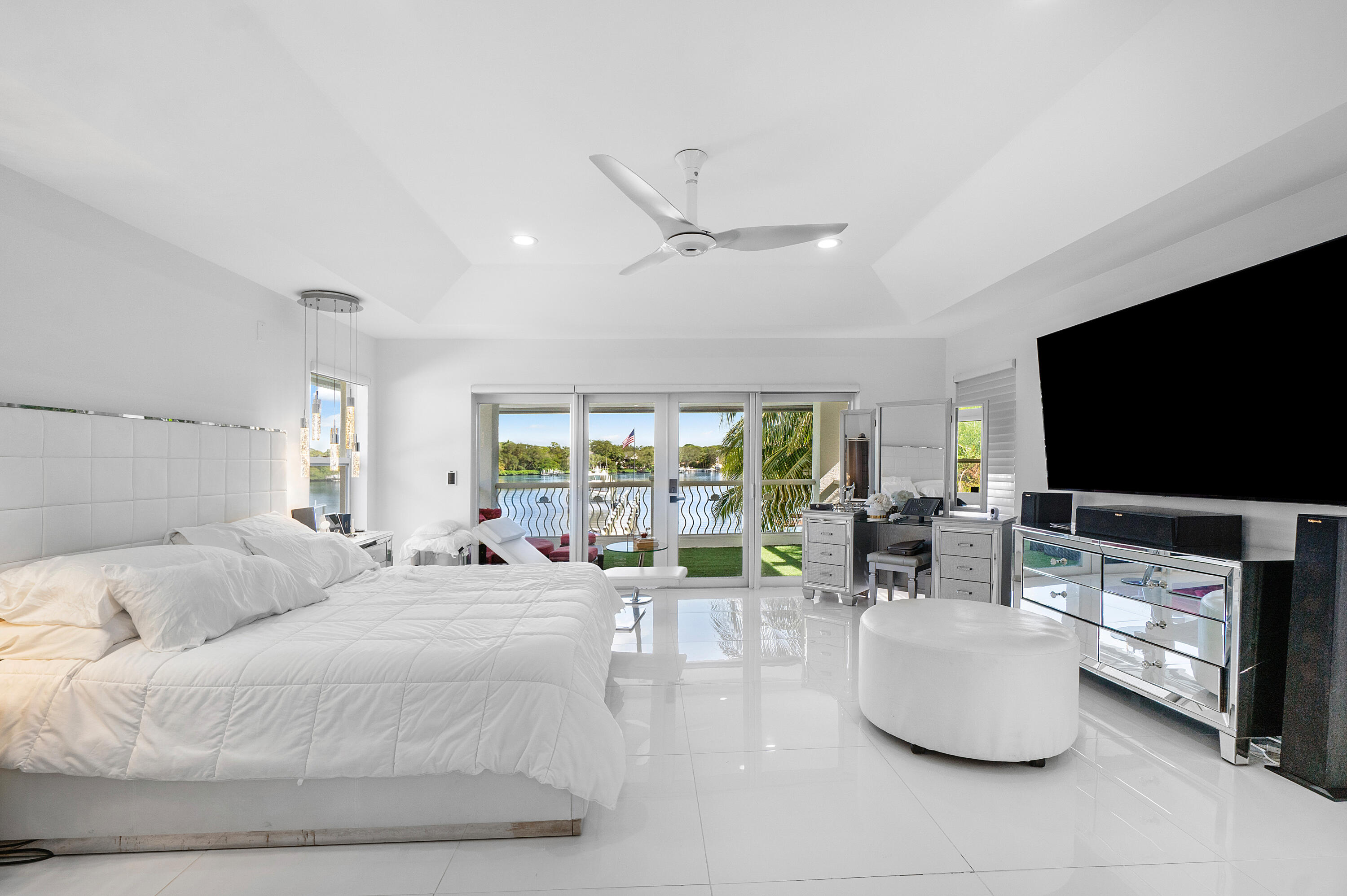 5447 Center Street Jupiter, FL 33458 - Photo 31 of 60 a living room with furniture and a flat screen tv