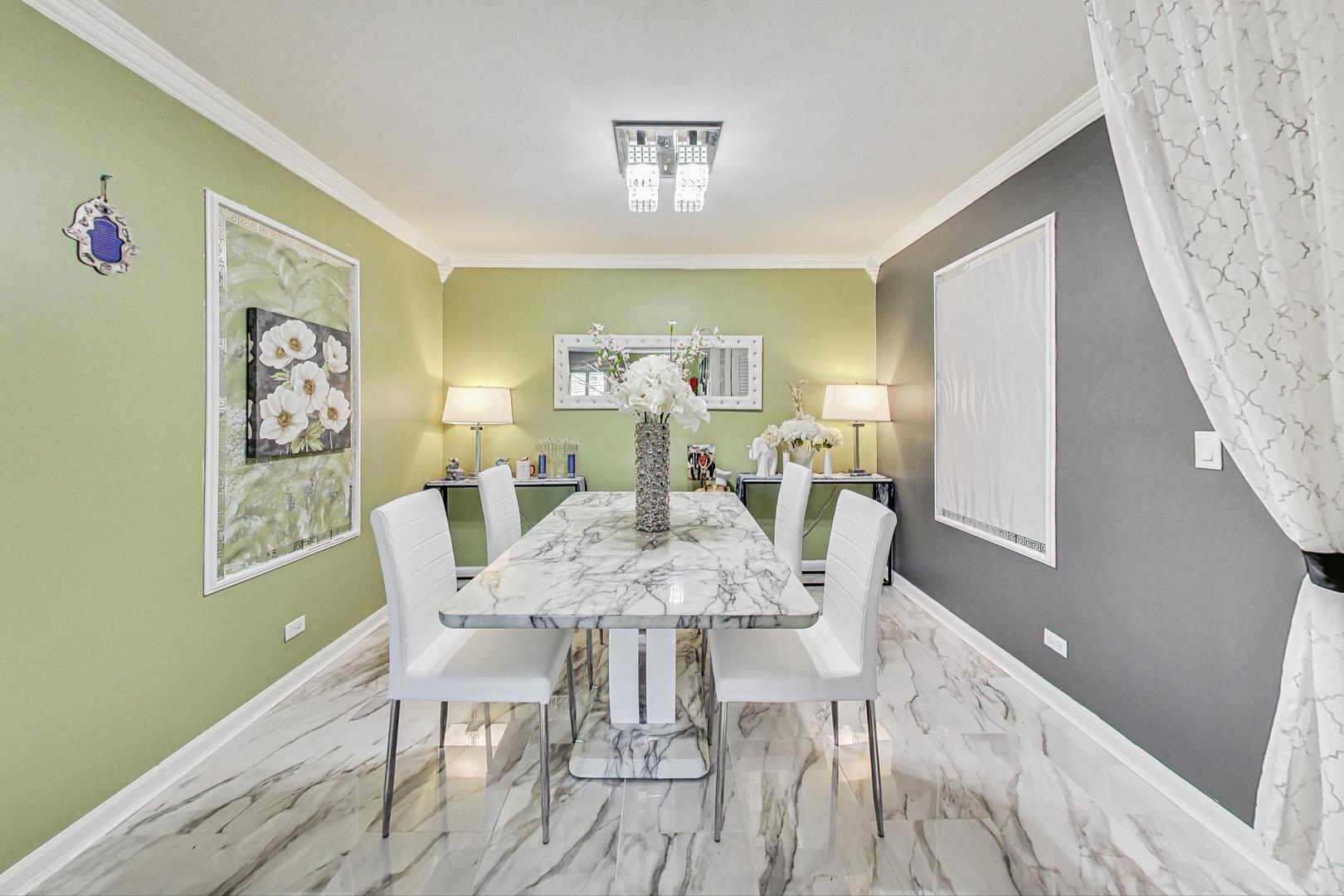 3900 Dundee Road, Unit 104 Northbrook, IL 60062 - Photo 12 of 34 a view of a dining room with furniture and wooden floor
