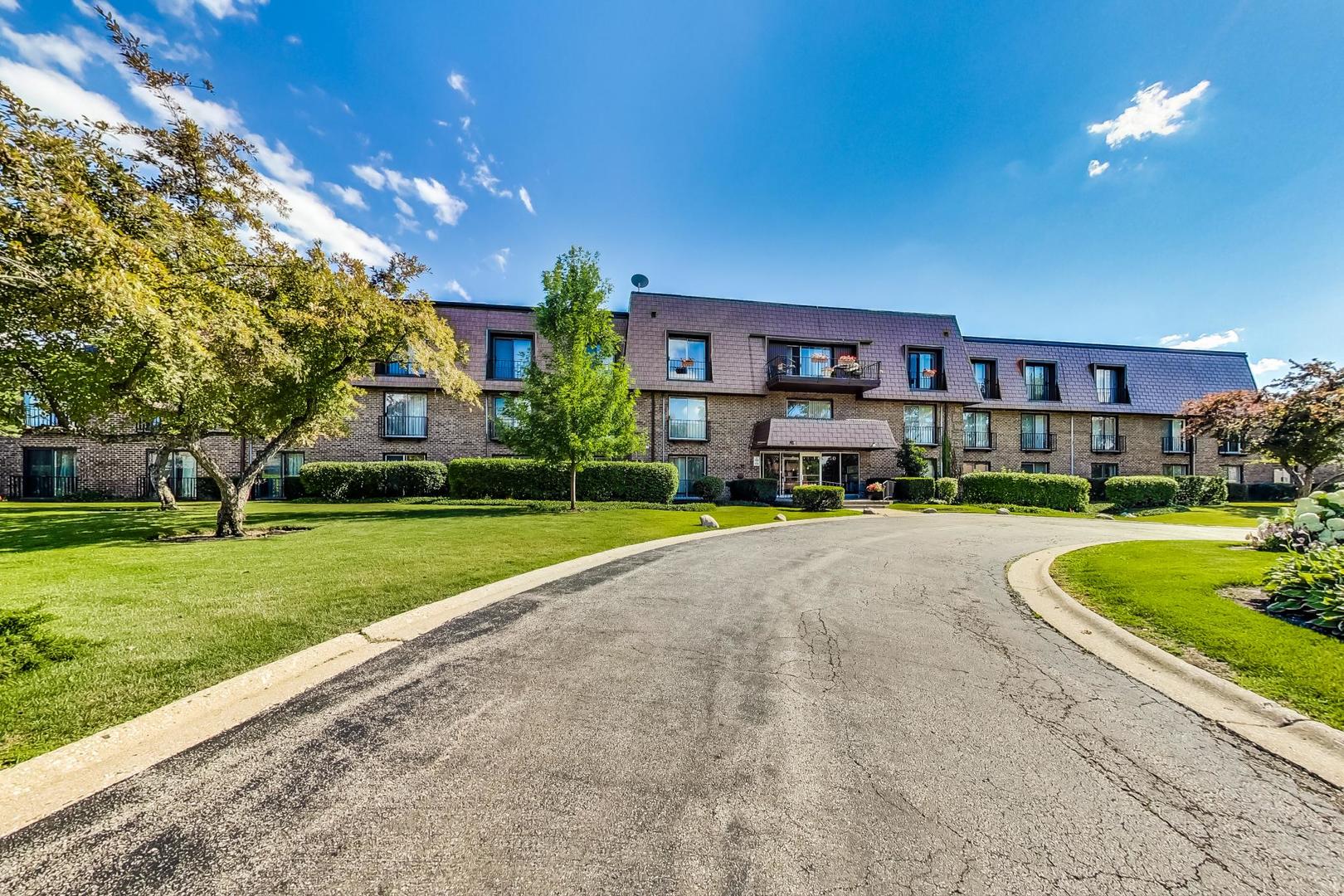 3900 Dundee Road, Unit 104 Northbrook, IL 60062 - Photo 2 of 34 a house view with a garden space