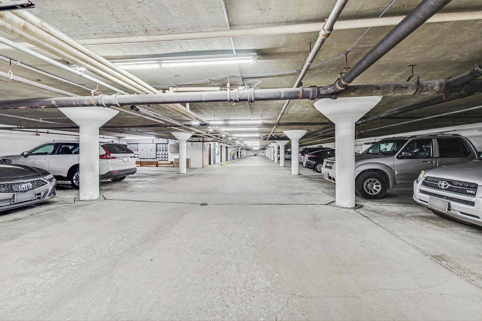 3900 Dundee Road, Unit 104 Northbrook, IL 60062 - Photo 24 of 34 a view of parking garage with cars