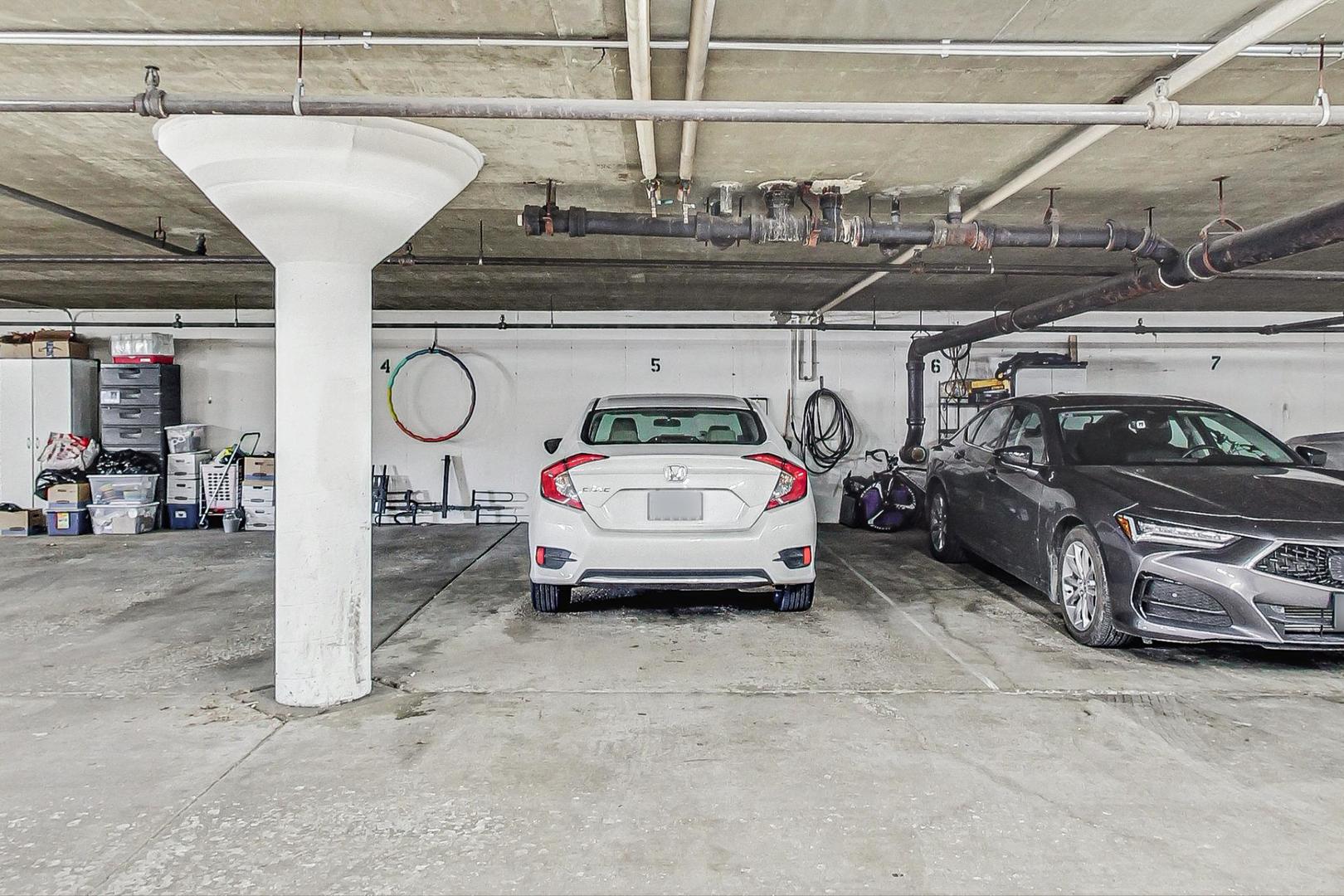 3900 Dundee Road, Unit 104 Northbrook, IL 60062 - Photo 25 of 34 a view of parking garage with cars parked