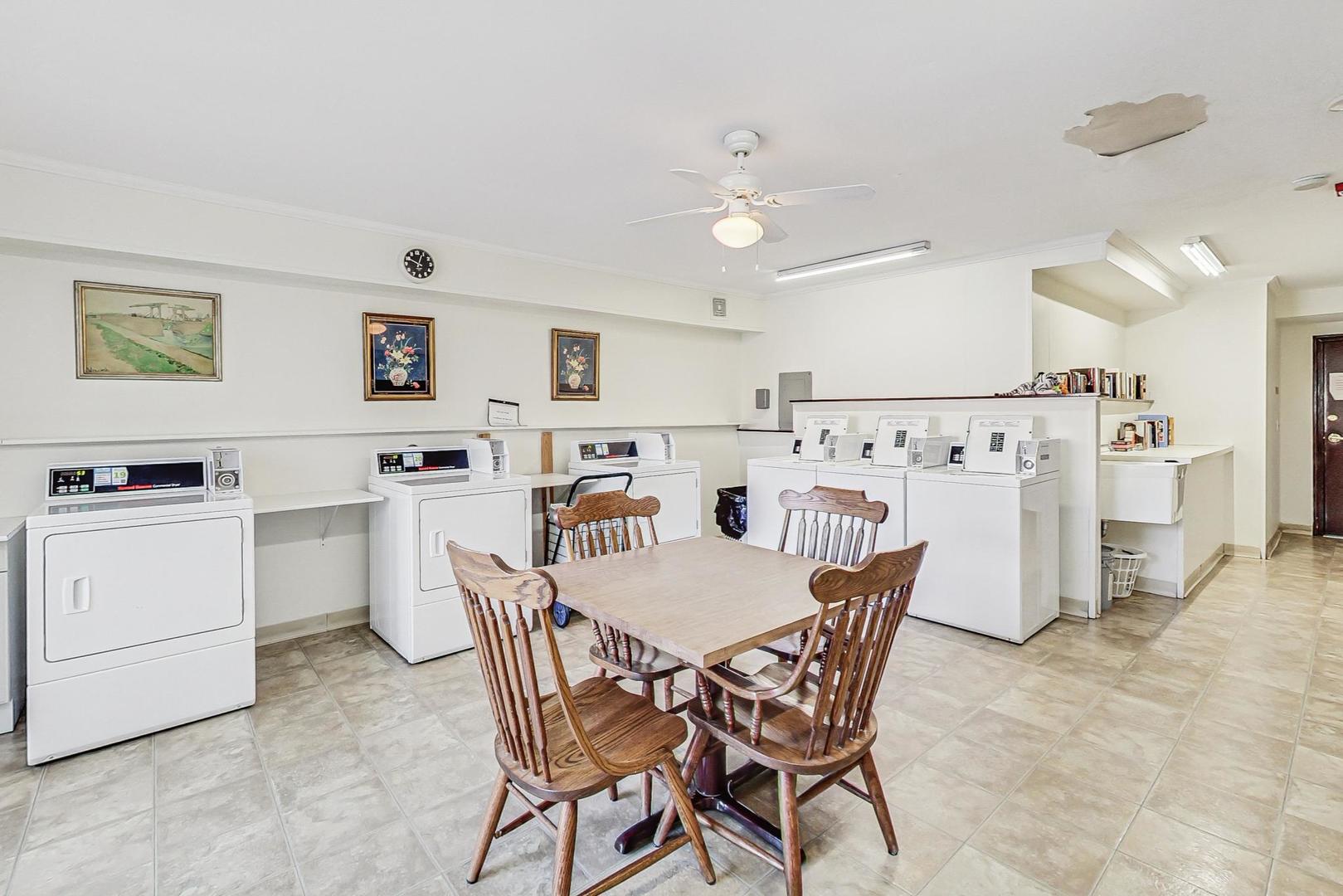 3900 Dundee Road, Unit 104 Northbrook, IL 60062 - Photo 27 of 34 a view of a dining room with furniture and wooden floor