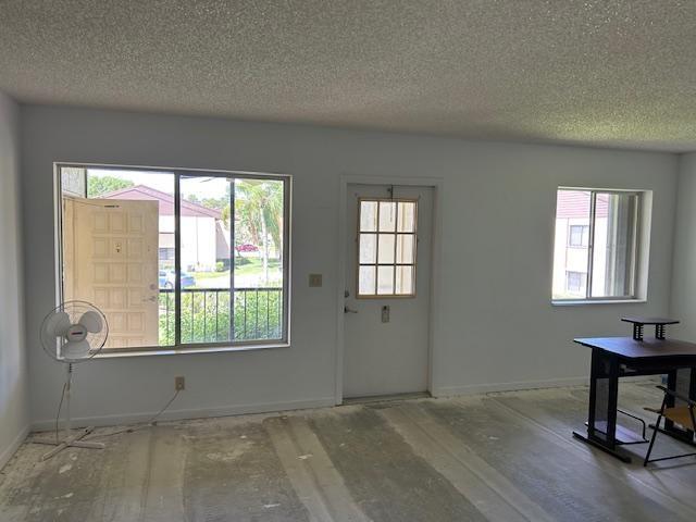 335 Knotty Pine Circle, Unit A2 Greenacres, FL 33463 - Photo 13 of 13 a view of an empty room with a window