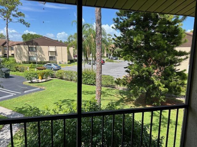 335 Knotty Pine Circle, Unit A2 Greenacres, FL 33463 - Photo 3 of 13 a view of lake from a balcony