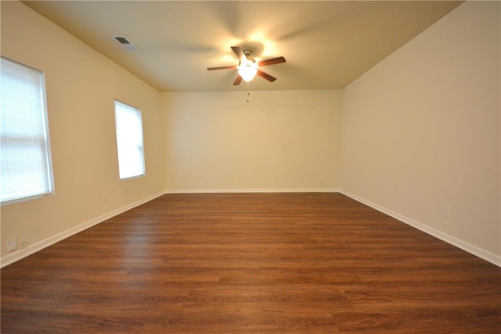 4305 Traipse Path Ellenwood, GA 30294 - Photo 14 of 36 wooden floor in an empty room with a window