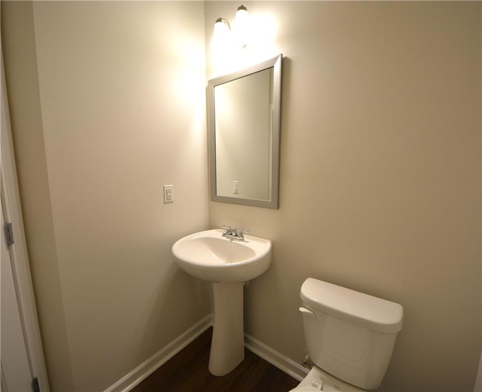 4305 Traipse Path Ellenwood, GA 30294 - Photo 20 of 36 a bathroom with a sink toilet and a mirror