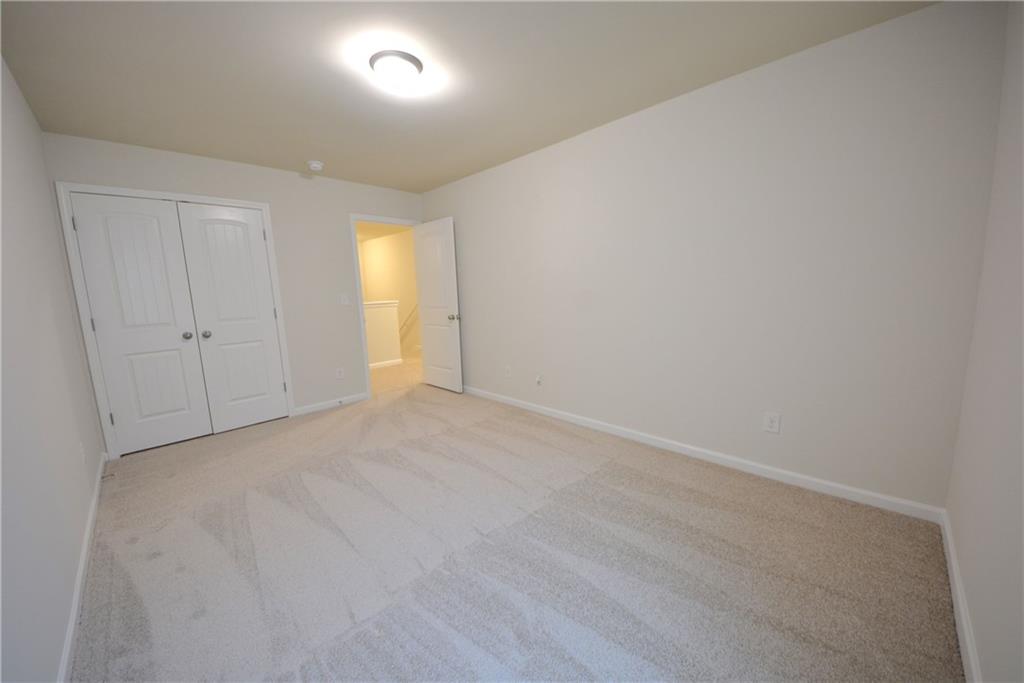 4305 Traipse Path Ellenwood, GA 30294 - Photo 30 of 36 a view of an empty room and a window