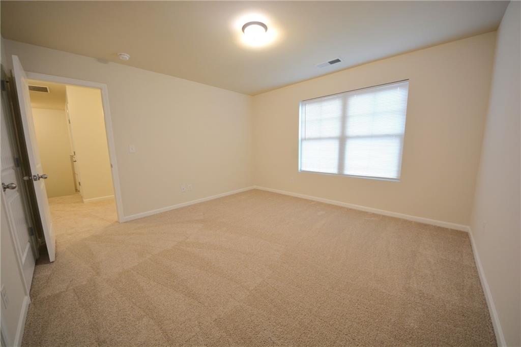4305 Traipse Path Ellenwood, GA 30294 - Photo 32 of 36 an empty room with a window