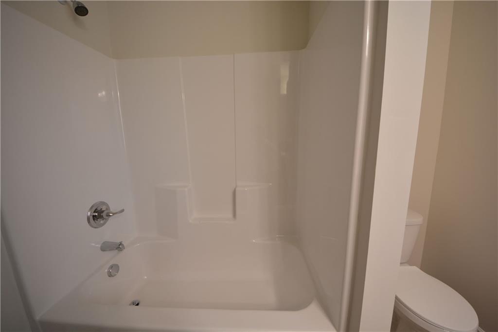 4305 Traipse Path Ellenwood, GA 30294 - Photo 34 of 36 a bathroom with a bathtub