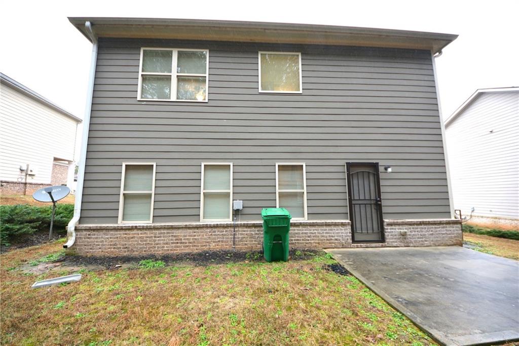4305 Traipse Path Ellenwood, GA 30294 - Photo 6 of 36 a view of a house with a yard