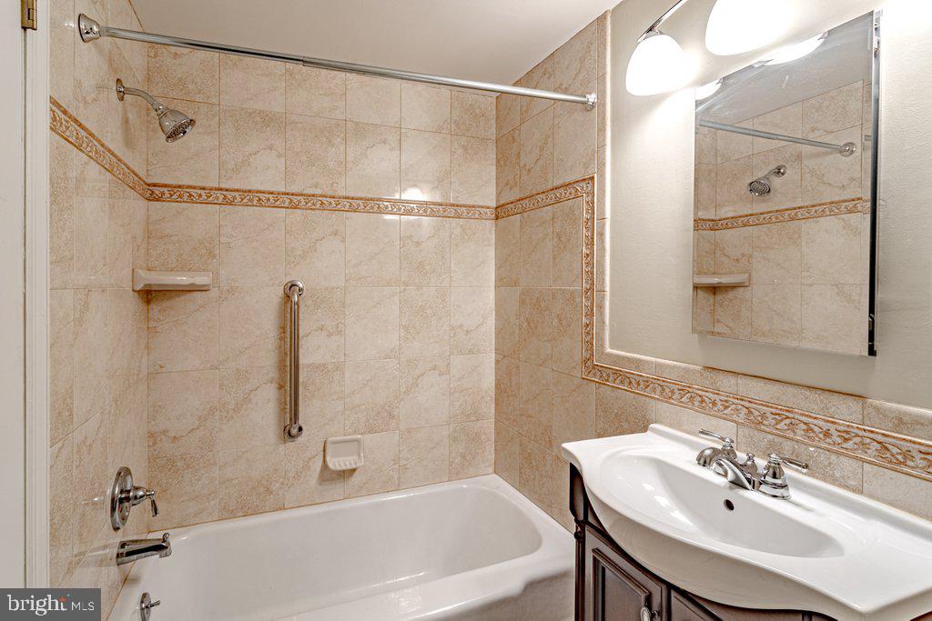 324 Wayland Road Cherry Hill, NJ 08034 - Photo 25 of 28 a bathroom with a sink shower and a mirror