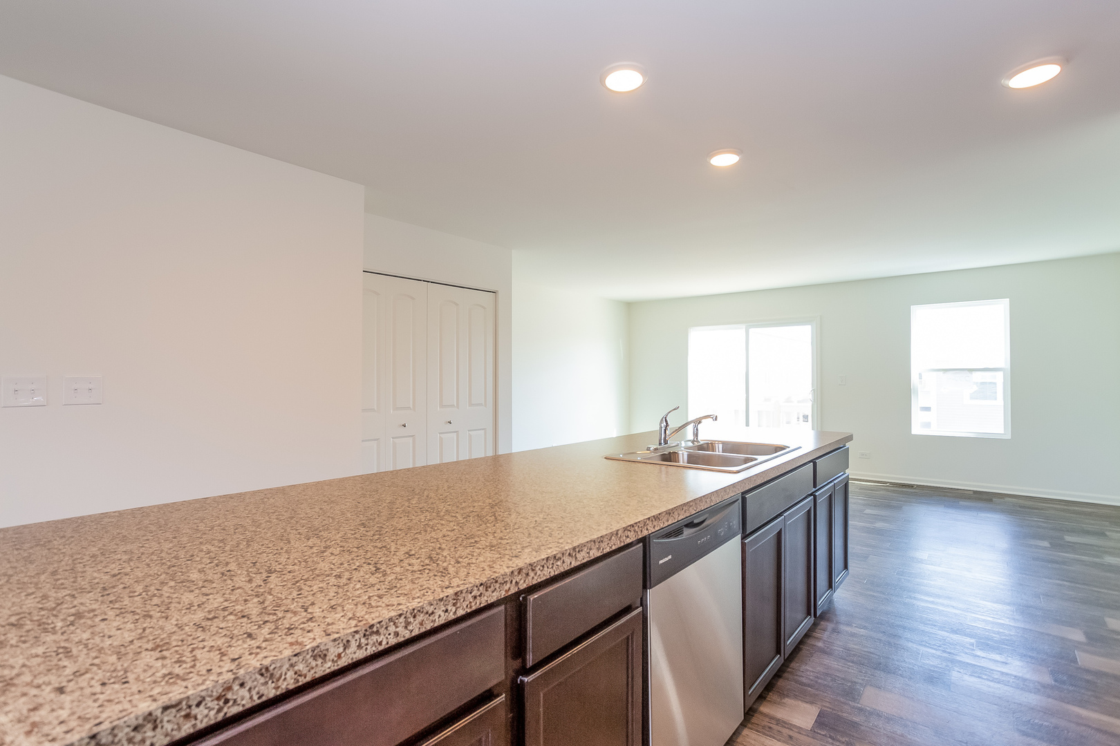 2407 Upland Road Pingree Grove, IL 60140 - Photo 4 of 19 a kitchen with granite countertop sink and cabinets