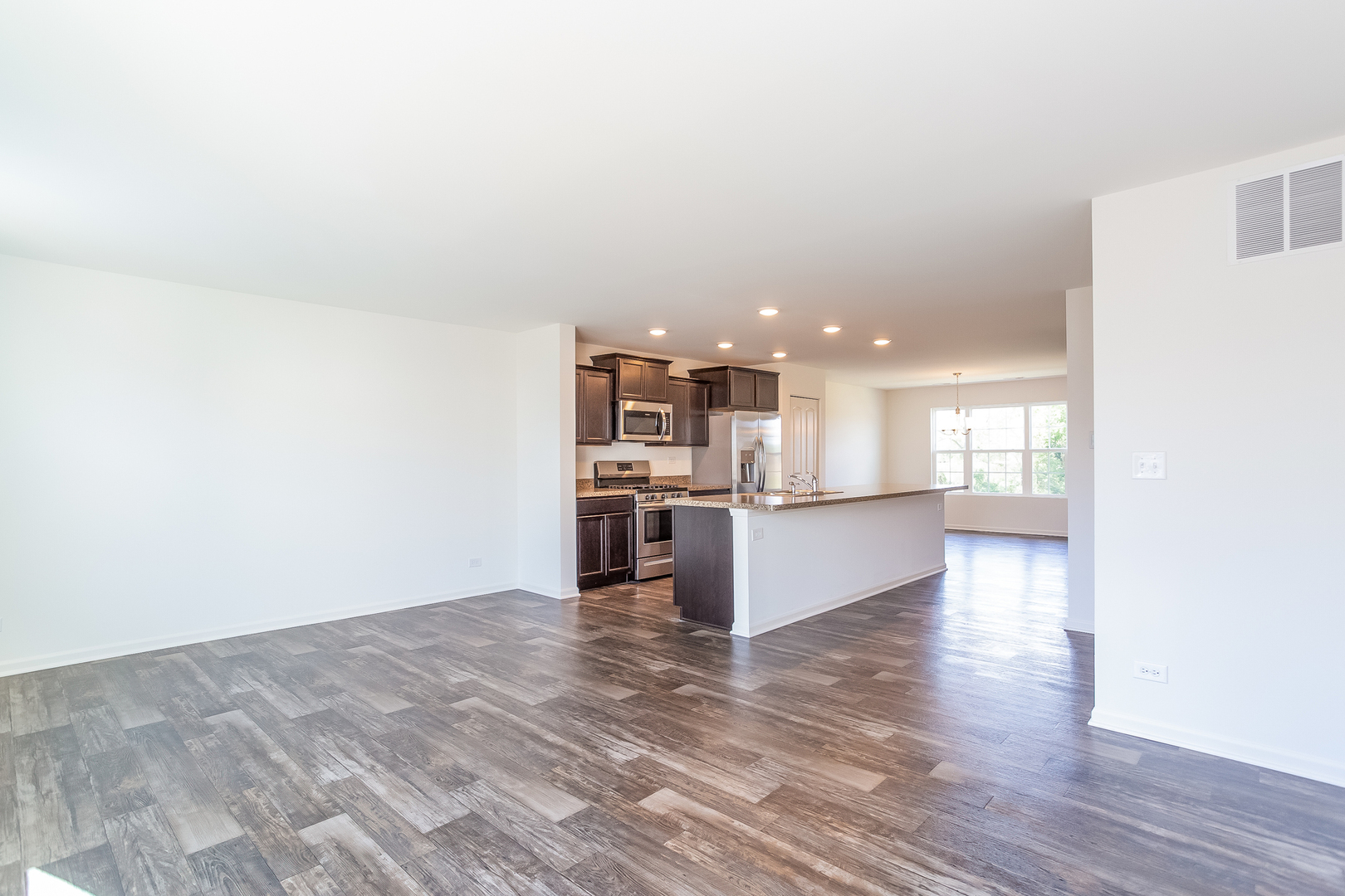 2407 Upland Road Pingree Grove, IL 60140 - Photo 5 of 19 a view of kitchen with kitchen island and stainless steel appliances
