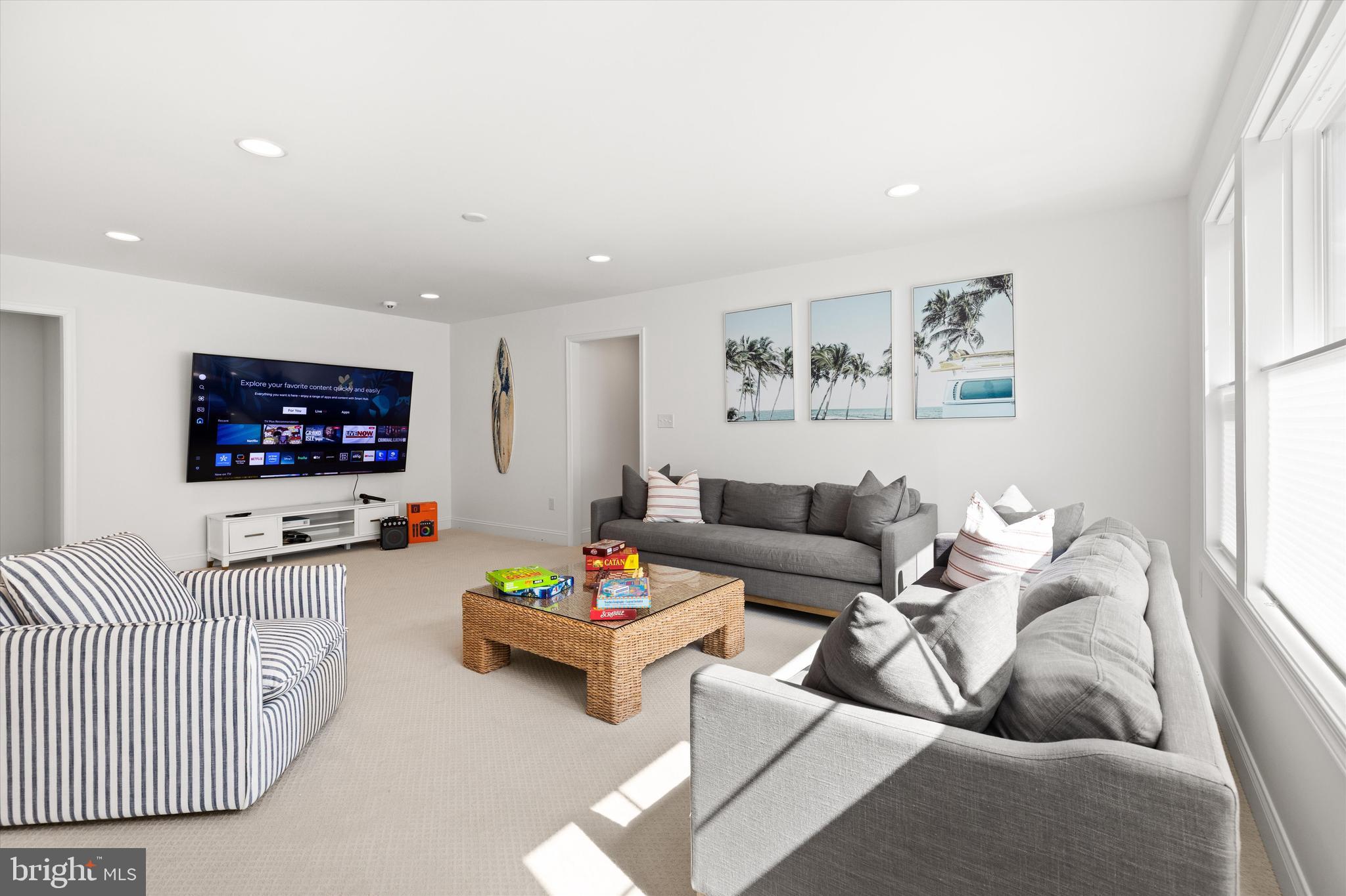 19277 American Holly Road Rehoboth Beach, DE 19971 - Photo 18 of 28 a living room with furniture and a flat screen tv