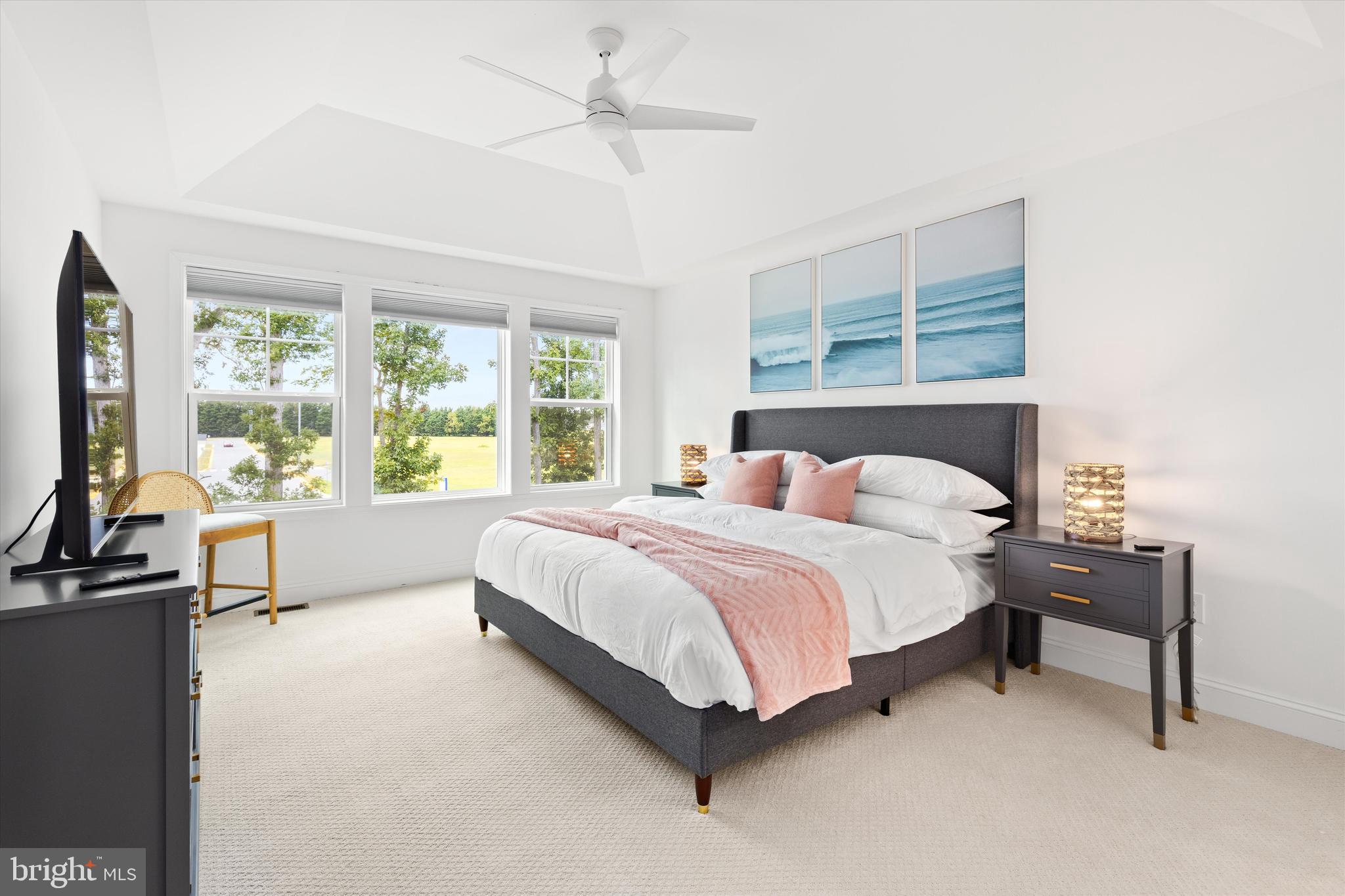 19277 American Holly Road Rehoboth Beach, DE 19971 - Photo 19 of 28 a spacious bedroom with a bed and a large window
