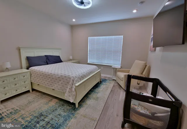 a bedroom with a bed and a dresser