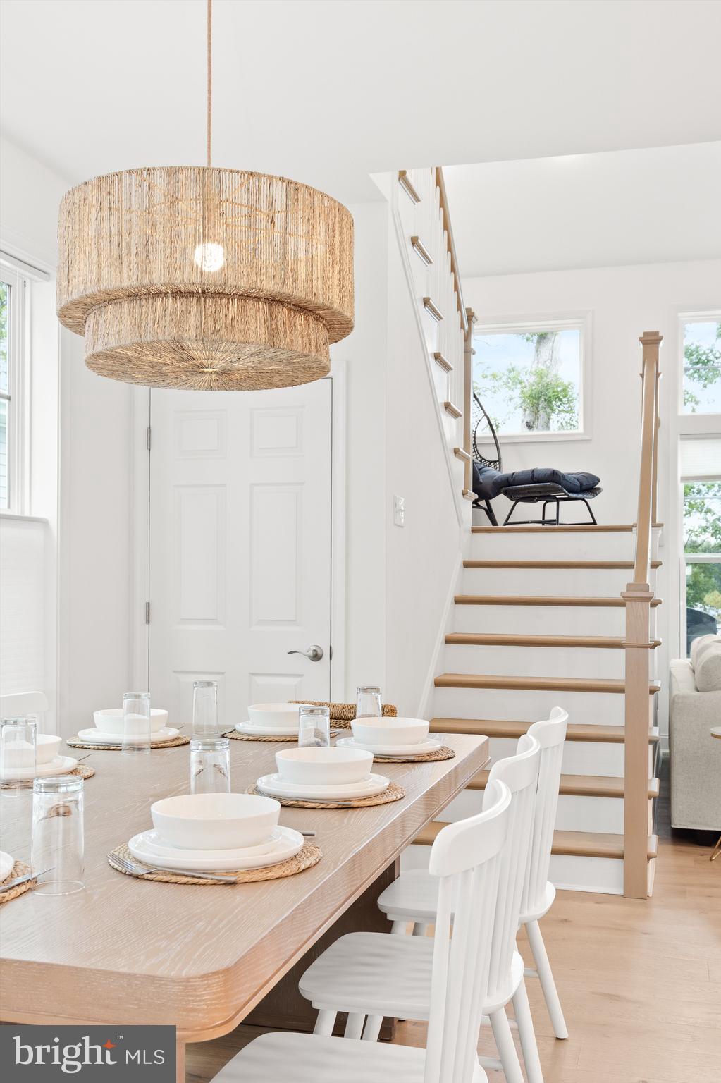 19277 American Holly Road Rehoboth Beach, DE 19971 - Photo 3 of 28 a bathroom with a granite countertop sink and a mirror