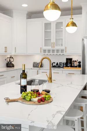 a kitchen with a sink and a stove