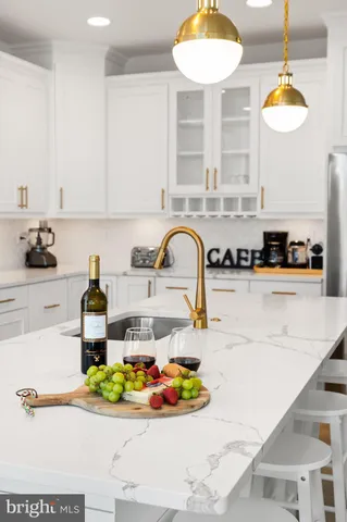 a kitchen with a sink and a stove