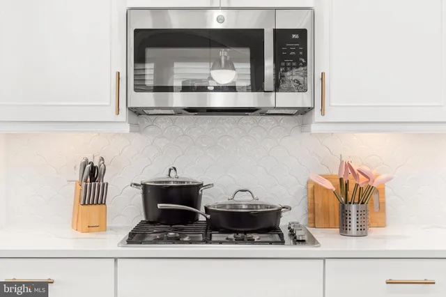 a kitchen with a stove and a microwave