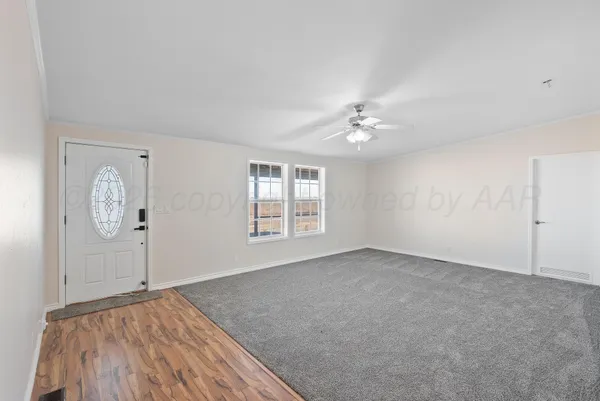 a view of a kitchen with granite countertop cabinets and wooden floor