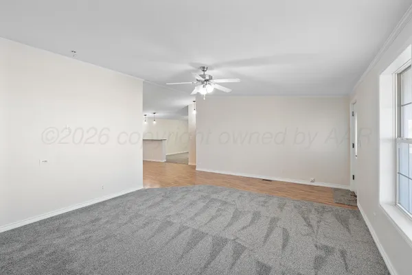 a kitchen with kitchen island granite countertop a sink cabinets and stainless steel appliances