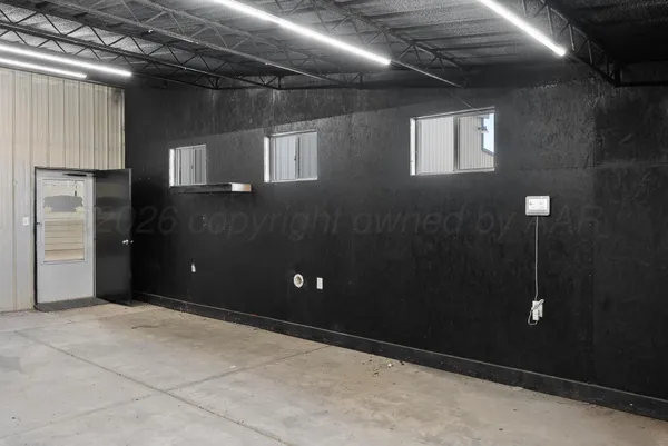 a white house with a beach