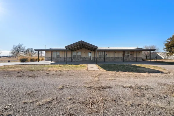 a view of a house with a street