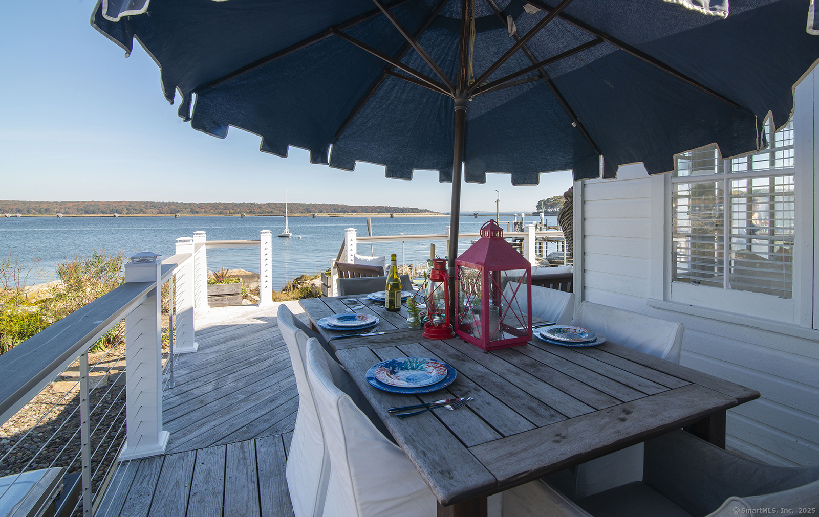 114 Jupiter Point Road Groton, CT 06340 - Photo 3 of 34 Porch Dining with view. Waterside deck with dining area perfect for alfresco meals.