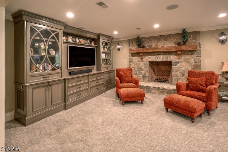 5 Burnett Road Mendham, NJ 07945 - Photo 37 of 50 a living room with furniture and a flat screen tv