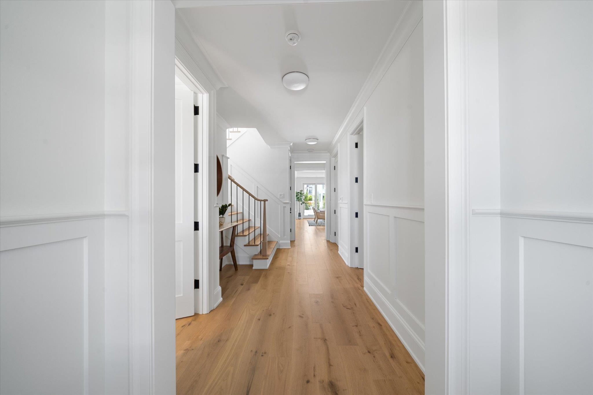 155 112th Stone Harbor, NJ 08247 - Photo 16 of 49 a view of a hallway with wooden floor and staircase