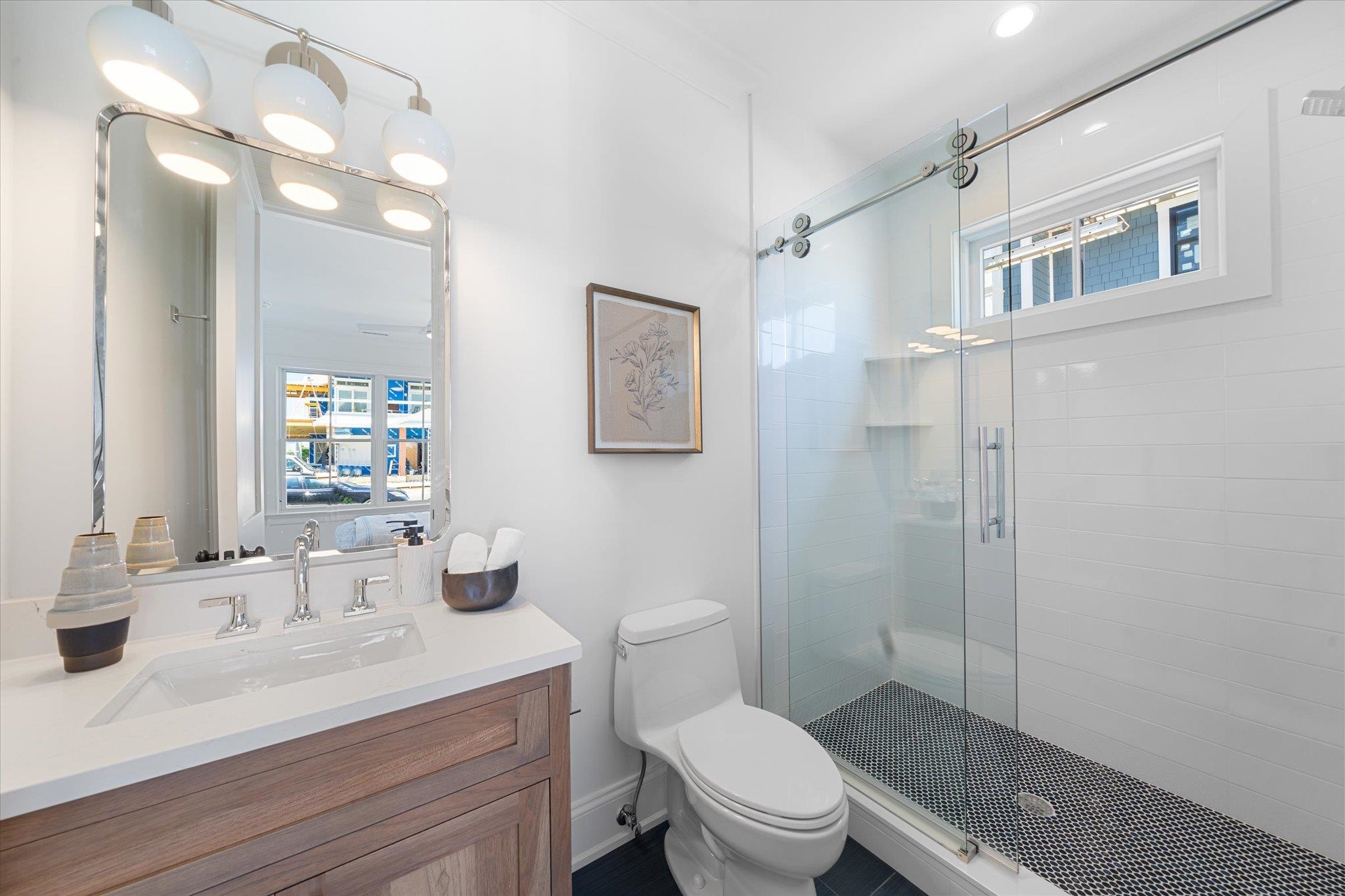 155 112th Stone Harbor, NJ 08247 - Photo 22 of 49 a bathroom with a sink a toilet a mirror and shower