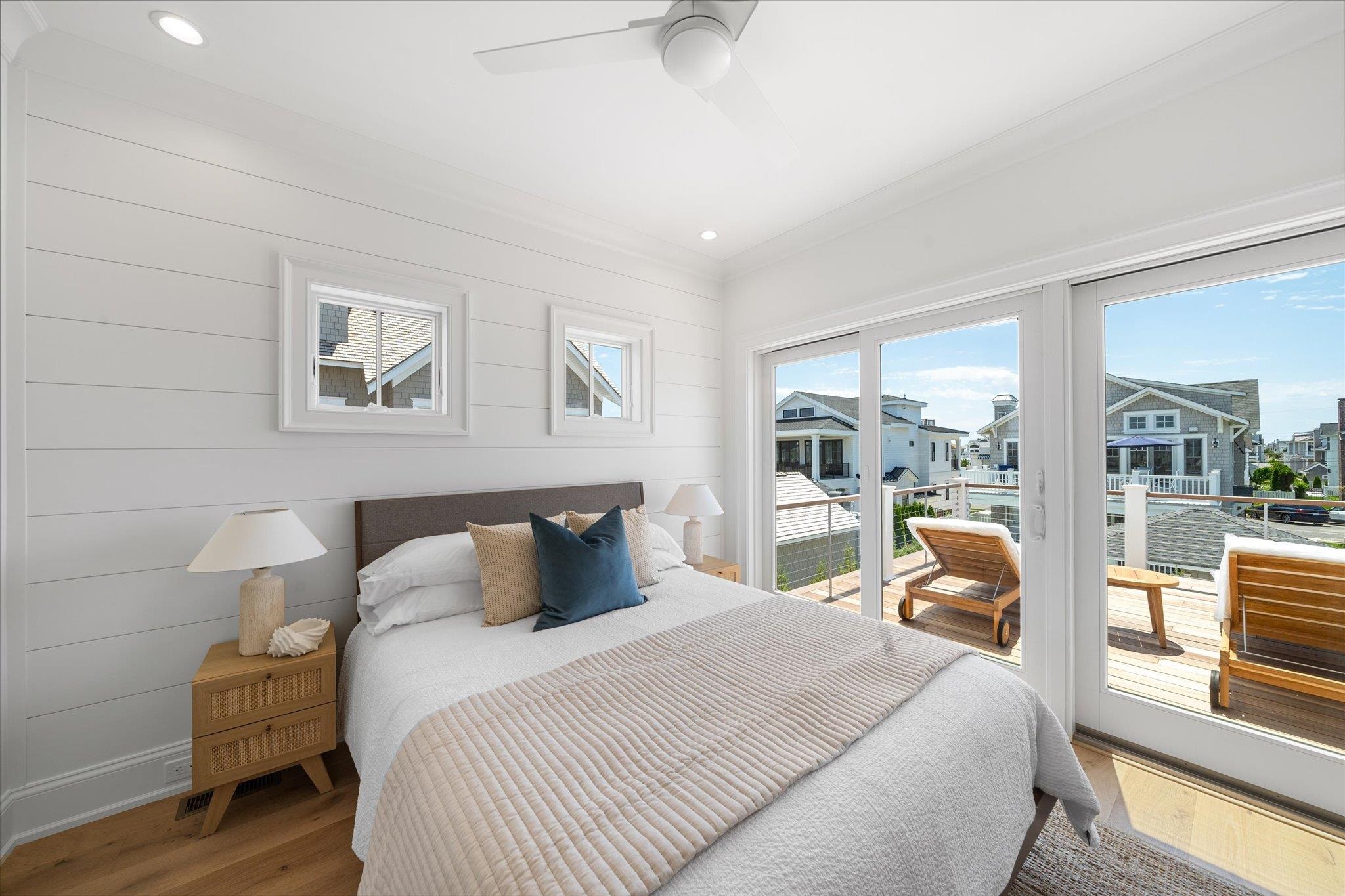 155 112th Stone Harbor, NJ 08247 - Photo 36 of 49 a bedroom with a large bed and a large window