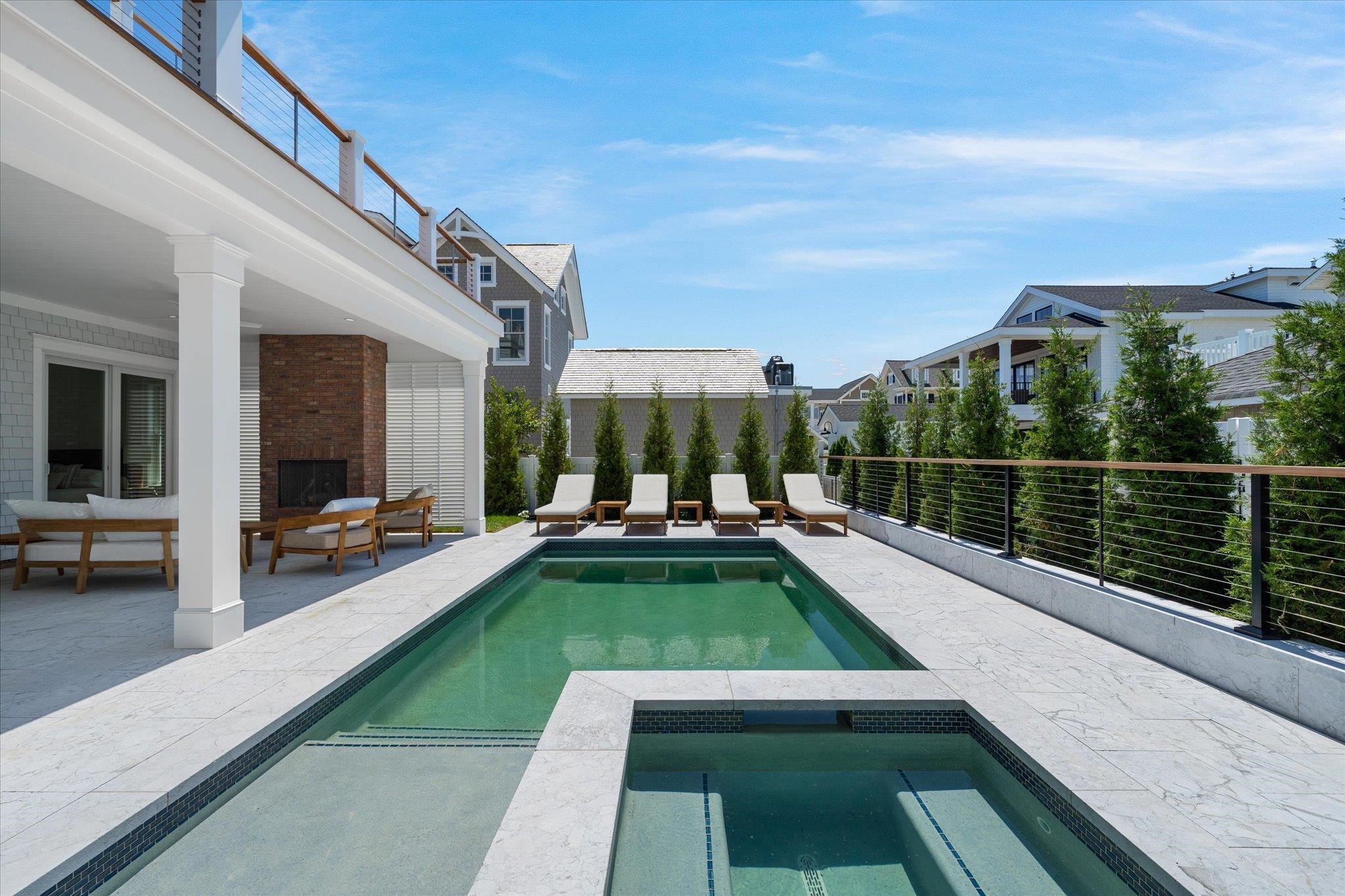 155 112th Stone Harbor, NJ 08247 - Photo 42 of 49 a view of swimming pool with a lounge chair