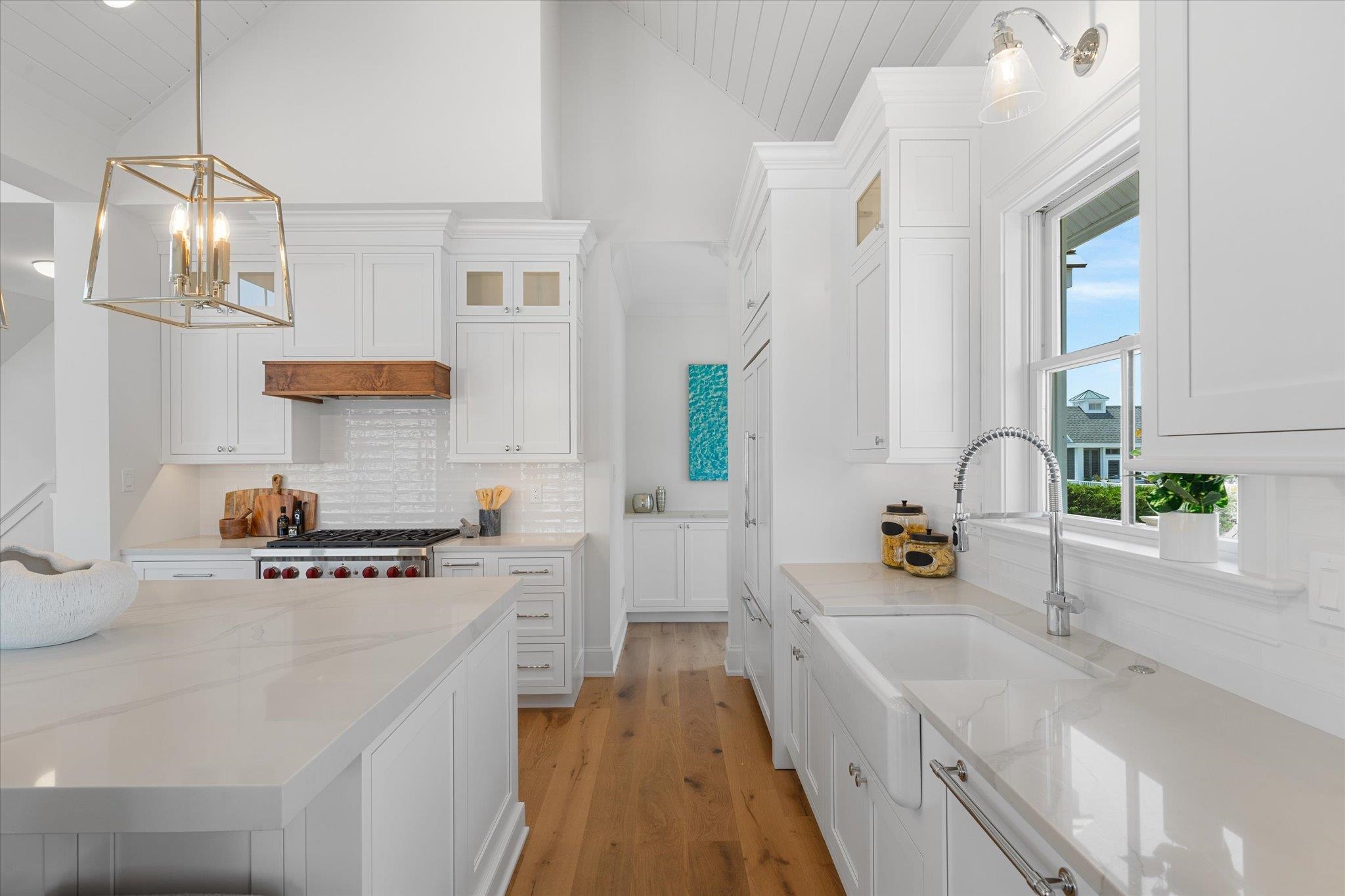 155 112th Stone Harbor, NJ 08247 - Photo 6 of 49 a kitchen with stainless steel appliances a sink a stove and white cabinets with wooden floor